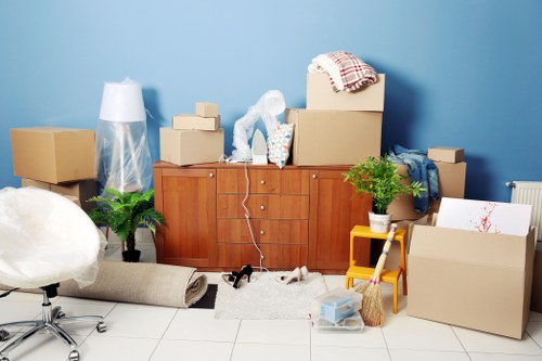 Professional furniture removals in Battersea with movers carrying a sofa