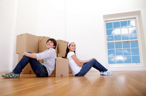 Professional movers loading furniture into a van in Battersea