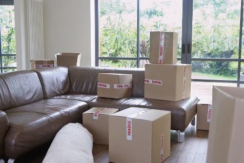 Packed moving boxes and furniture ready for house removal service
